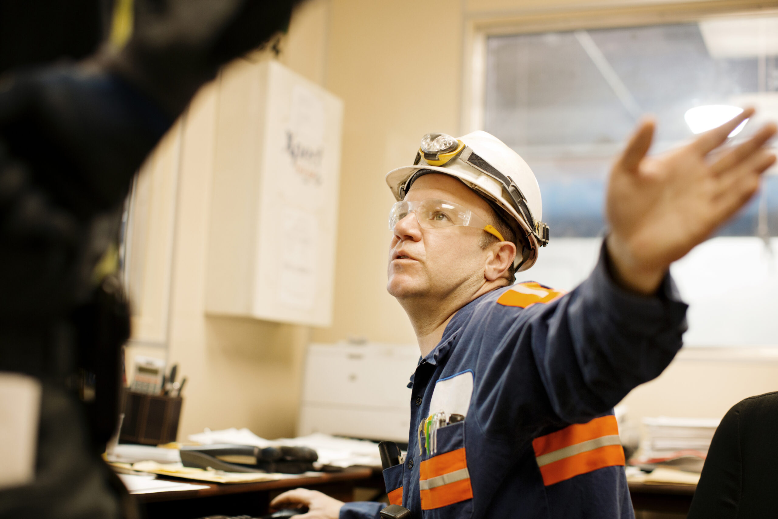 Side View Of Mature Male Worker Working In Office